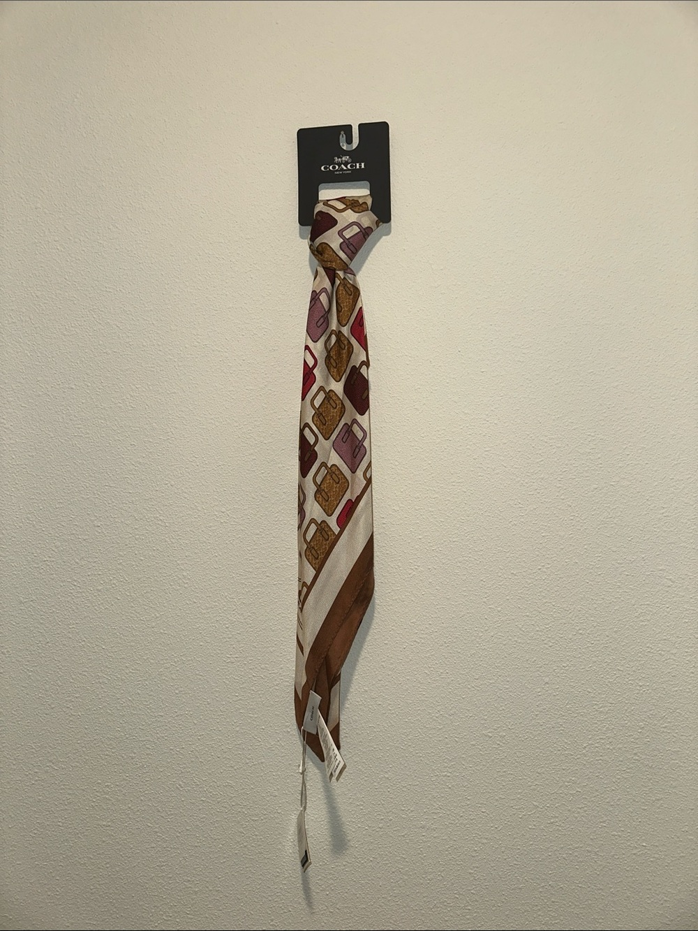 Coach Men’s Cream Tie with Brown, Pink & Burgundy Bag Motif